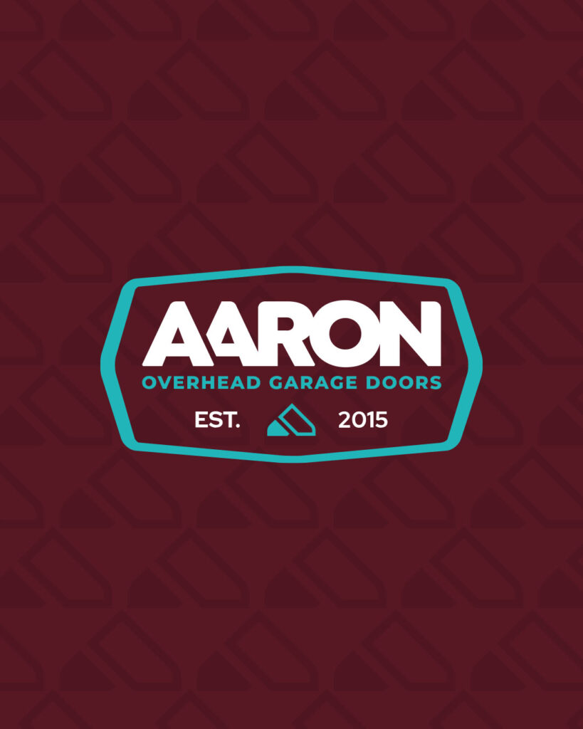 Logo for Aaron Overhead Doors with white text and teal border on a maroon background, featuring "EST. 2015" and a small icon below the company name.